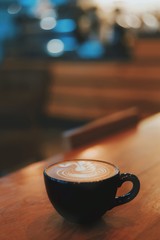 Coffee cup on wooden table.