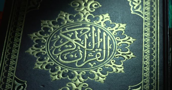 Holy Quran Cover on Book Rest Shift Focus