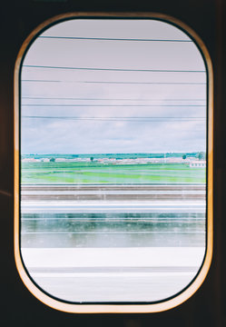 View from high speed train window in motion of countryside