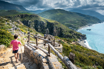 Fototapeta na wymiar Tourist capturing photo of Greece islands from cliff point.
