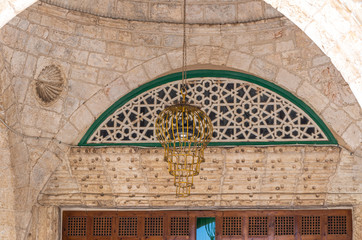 The decorative metal lantern hanging at the entrance to the Al Aqsa Mosque in the interior of the Temple Mount in the Old City in Jerusalem, Israel