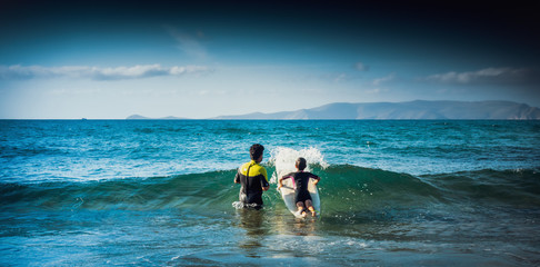 Boy surfing on the Mediterranean island, Greece