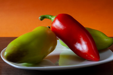 bell pepper in a plate on an orange background