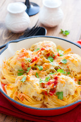 Tagliatelle pasta with meat balls and sauce, selective focus