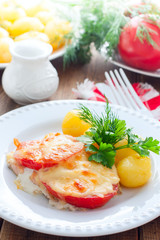 Baked pink salmon with tomato and cheese, selective focus