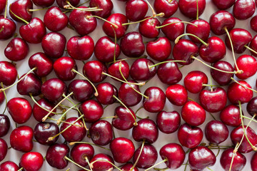 Sour red cherry pattern. Design of food and fruit background, berry texture. Horizontal cherry image..