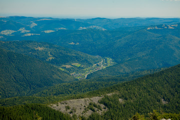 Obraz premium Beautiful mountain landscape, with mountain peaks covered with forest and a cloudy sky. Ukraine mountains, Europe