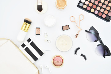 A set of beauty cosmetics or make-up laid flat on white background. Woman desktop still life concept