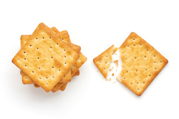 Crushed dry cracker cookies isolated on white background.