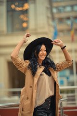 Beautiful brunette fashionable woman posing in Bucharest.