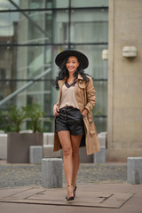 Obraz premium Beautiful brunette fashionable woman posing in Bucharest.