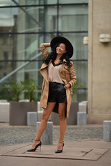 Obraz premium Beautiful brunette fashionable woman posing in Bucharest.