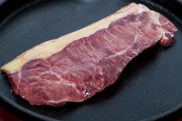 A fresh steak on the chopping board