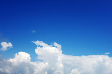 Naklejka na ściany i meble Picturesque sunny sky with clouds