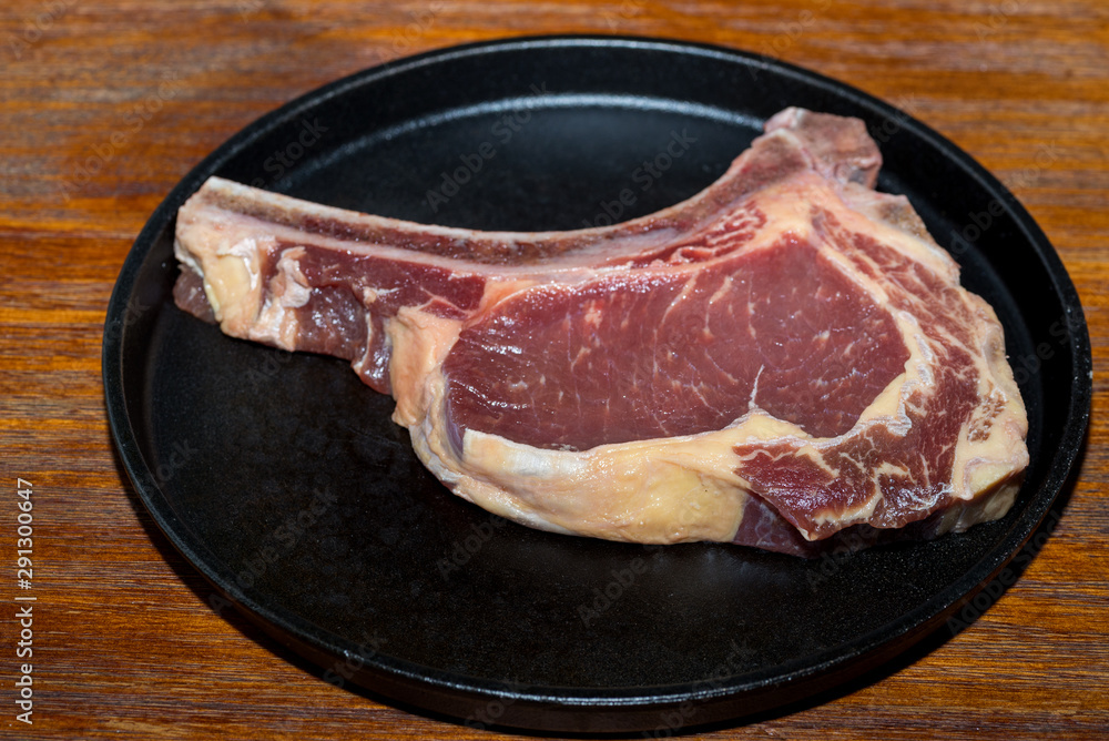 Wall mural A fresh steak on the chopping board