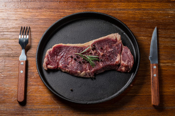 A fresh steak on the chopping board