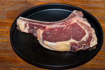 A fresh steak on the chopping board