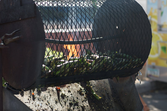 Chili Roaster With Fresh Green Chilis At Local Farmers Market