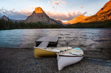A sunrise across Two Medicine Lake in Glacier National Park, Montana, USA
