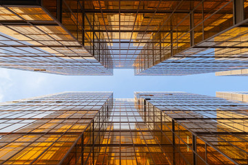 Golden building. Windows glass of modern office skyscrapers in technology and business concept....
