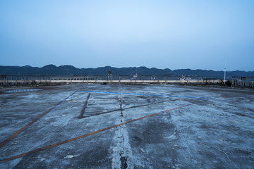 Cement floor on roof, helicopter apron