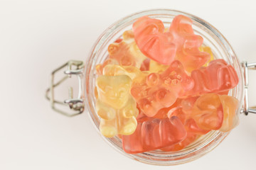 fruity gummy bears in a glass jar