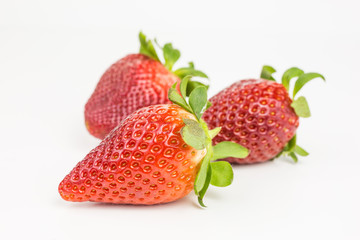 group of  ripe red strawberries - fragaria