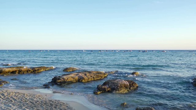 Sea waves breaking in Santo Tomas beach on the mediterranean island of Menorca or Minorca
