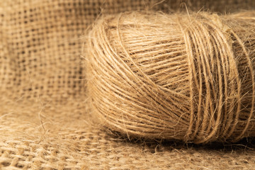 Linen rope roll and natural linen fabric texture.  Soflt light and isolated view.