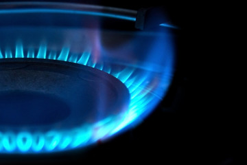 Flame of gas on kitchen stove. Selective focus.
