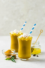 Turmeric marshmallow cinnamon hot drink. Selective focus, copy space.