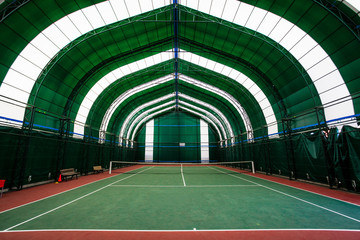 Indoor tennis court. Covered with a green coating