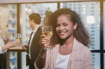 Woman with glass of wine with smile.