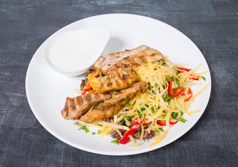 Delicious salad with cheese and chicken fillet.