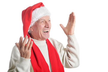 Happy senior man in Santa hat isolated on white background