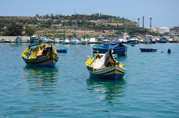 Fototapeta premium Marsaxlokk, fishing village in Malta, colorful boats