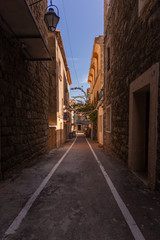 Empty narrow street in the historical centre of Porto-Vecchio, France
