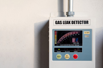 gas leak detector box on cement wall