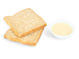 Pouring condensed milk with sugar in a bowl.