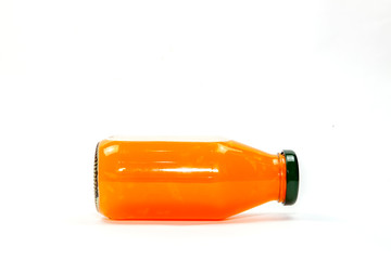 Orange juice in glass bottle Isolated on a white background.