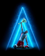 Soccer neon concept. Soccer player celebrate victory. Blue neon light. Isolated