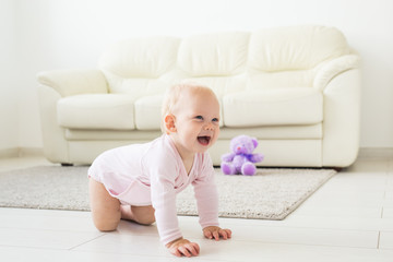 beautiful smiling baby crawling for the first time.