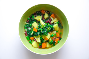 Healthy vegan soup full of vegetables, minerals, proteins and vitamins. Broccoli, potatoes and peas are the main ingredients. Red carrots, beans and spinach must also be included.