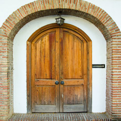 Typical Spanish wooden door. Entrance to the house or garden. Spanish door. Marbella Andalucia Spain.