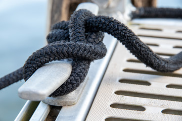 Rope knots tied to dock, closeup