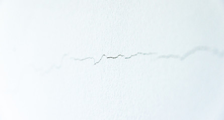 Crack on the wall. Shift foundations on the building and extended bricks. Building problems or...