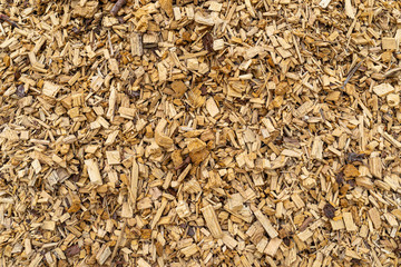 Background made of wood chips, closeup shot, wooden texture.