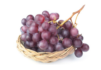 grapes in a basket isolated on white