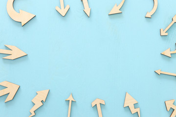 Background of blue wooden table and direction arrows