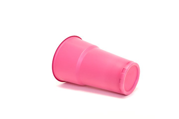  plastic pink cup on a white background